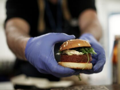 MADRID, SPAIN - DECEMBER 04: A cooker prepares the burguer 'Beyond Meat' which is made of