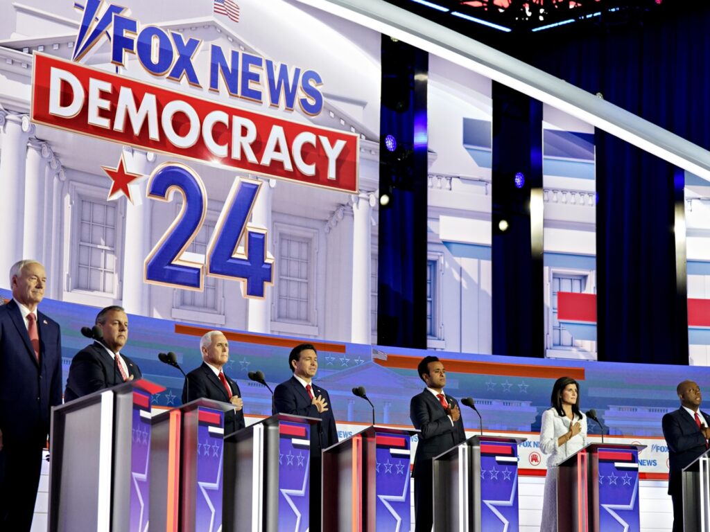 2024 Republican presidential candidates Asa Hutchinson, from left, Chris Christie, former Vice President Mike Pence, Ron DeSantis, Vivek Ramaswamy, Nikki Haley, Senator Tim Scott and Doug Burgum during the Republican primary presidential debate hosted by Fox News in Milwaukee, Wisconsin, US, on Wednesday, Aug. 23, 2023. Republican presidential contenders are facing off in their first debate of the primary season, minus frontrunner Donald Trump, who continues to lead his GOP rivals by a double-digit margin. Photographer: Al Drago/Bloomberg