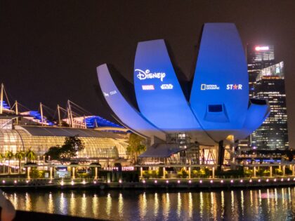 SINGAPORE - 2021/02/24: People are seen watching Disney+ showcase that was projected at the Singapore Art Science Museum and the Marina Bay Sands Singapore. Disney+ was launched in Singapore on the 23rd February 2021 making the country the first in the world to receive all Disney+ content brands including Disney, …