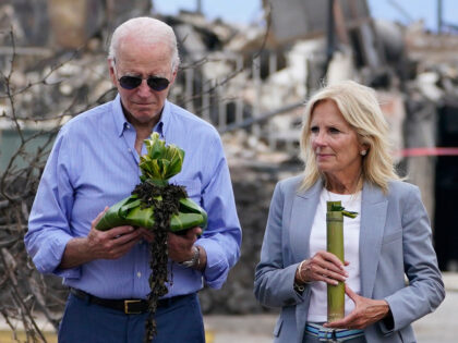 President Joe Biden and first lady Jill Biden participate in a blessing ceremony with the Lahaina elders at Moku'ula as they visit areas devastated by the Maui wildfires, Monday, Aug. 21, 2023, in Lahaina, Hawaii. (AP Photo/Evan Vucci)