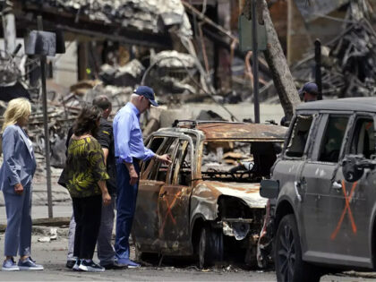 President Joe Biden and first lady Jill Biden look at a burned car with Hawaii Gov. Josh G