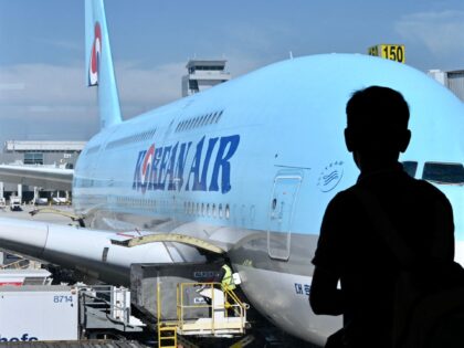 A Korean Air plane sits at the gate at Los Angeles International Airport (LAX) in Los Ange