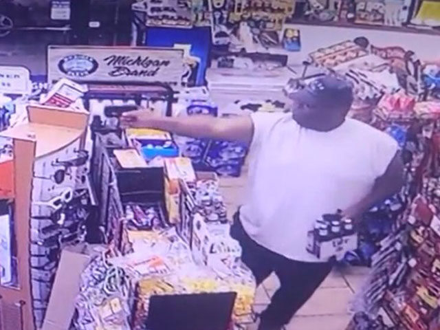 Surveillance video has been released showing a Cassopolis, Michigan, convenience store customer with a six-pack of beer in one hand and a pistol in the other opening fire on an alleged robber.
