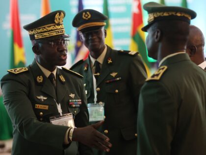 Members of the Armed Forces of Senegal discuss on the sidelines of the Economic Community of West African States (ECOWAS) Head of States and Government extraordinary session in Abuja, on August 10, 2023. West African leaders came together Thursday for an emergency summit on the coup in Niger, whose new …