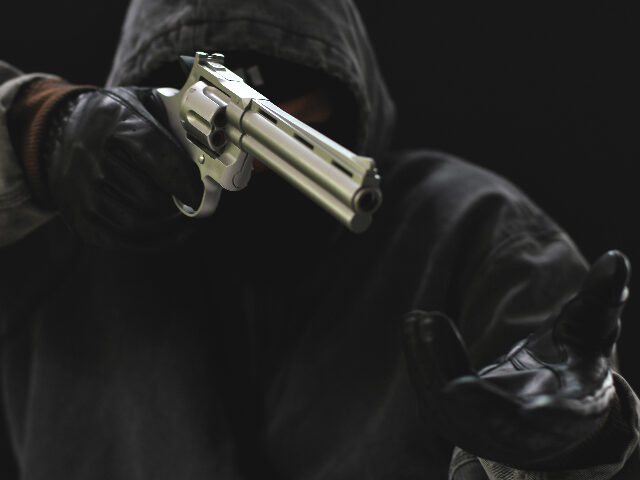 Masked Armed robbers pointing a handgun to robbery the money, Uses Gun in Armed Robbery, G