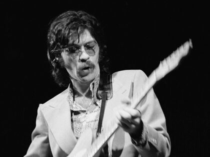 Canadian musician Robbie Robertson performing with The Band at the Royal Albert Hall, Lond