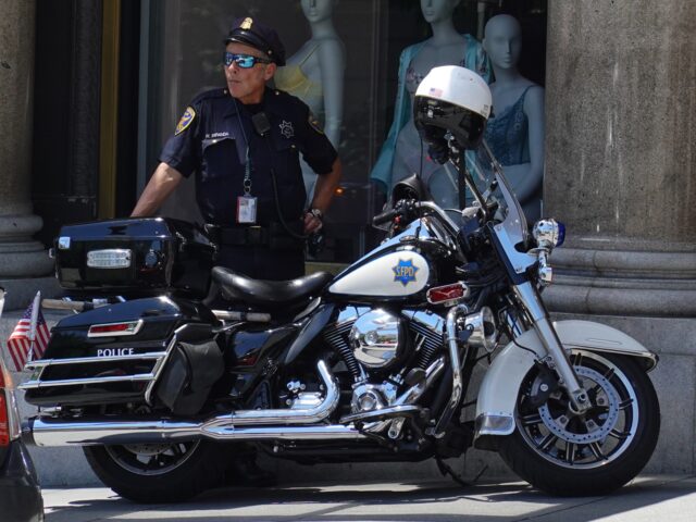 SAN FRANCISCO, CALIFORNIA - MAY 24: A San Francisco police officer looks on while patrolli