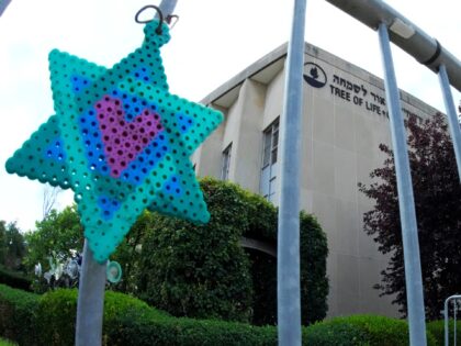 A Star of David hands from a fence outside the dormant landmark Tree of Life synagogue in Pittsburgh's Squirrel Hill neighborhood on Thursday, July 13, 2023, the day a federal jury announced they had found Robert Bowers, who in 2018 killed 11 people at the Tree of Life synagogue, eligible …