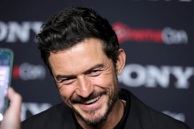 Actor Orlando Bloom is interviewed while promoting 'Gran Turismo' at a Las Vegas event on