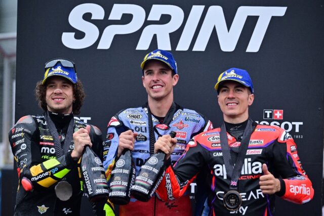Alex Marquez (centre) is all smiles on the Silverstone sprint podium