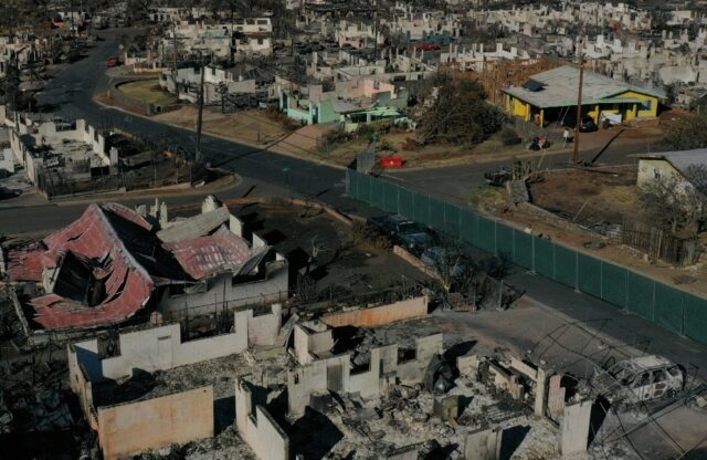 An aerial image shows destroyed homes and vehicles in the aftermath of the Maui wildfires