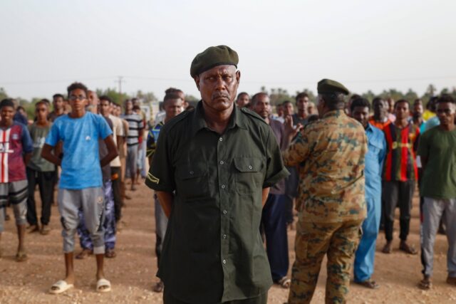 An officer of Sudan's regular army addresses new recruits in the Kassinger area of Norther