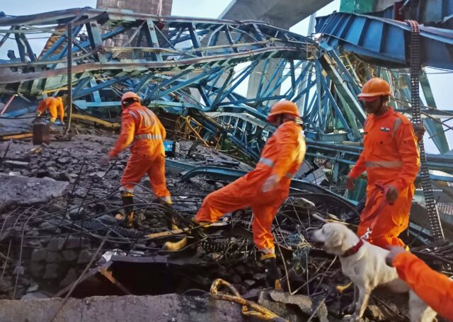 At least 20 workers were crushed to death in western India on Tuesday when a crane collaps