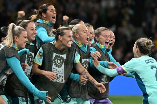 Australia defender Stephanie Catley (R) celebrates with teammates in Melbourne
