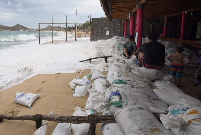 Businesses in Mexico's tourist resort of Cabo San Lucas await the arrival of powerful Hurr