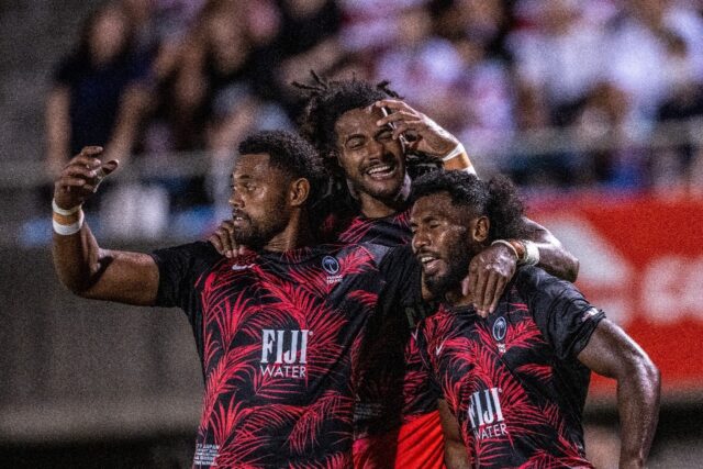 Fiji's Selestino Ravutaumada (C) celebrates with teammates during the international rugby