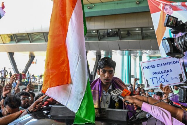 India's chess grandmaster and silver medallist Rameshbabu Praggnanandhaa is welcomed upon