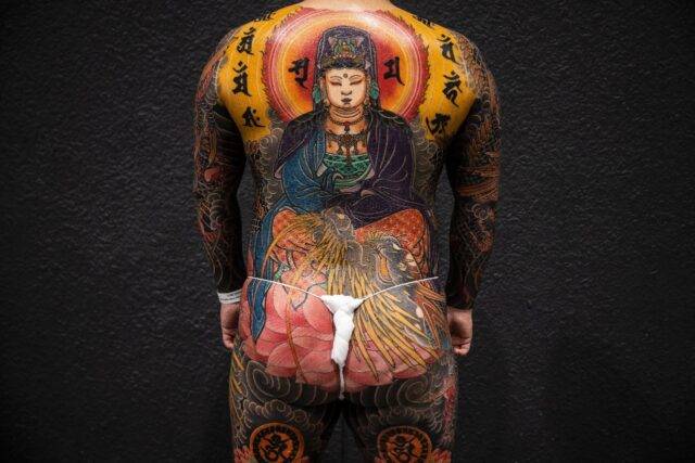 A man shows his intricate tattoos at the 7th Hong Kong China International Tattoo Conventi