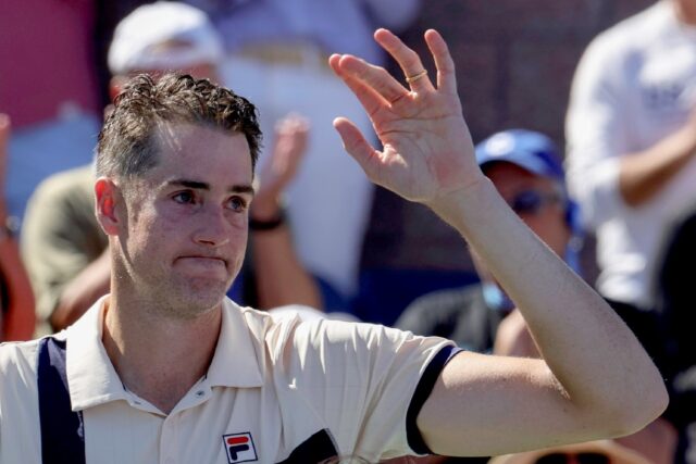 John Isner waves goodbye after bringing an end to his tennis career at the US Open