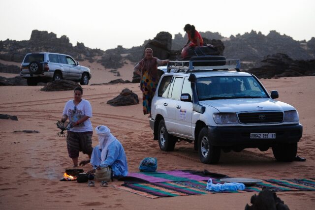 Local tour guides set up camp in the desert near the oasis town of Djanet in southeastern