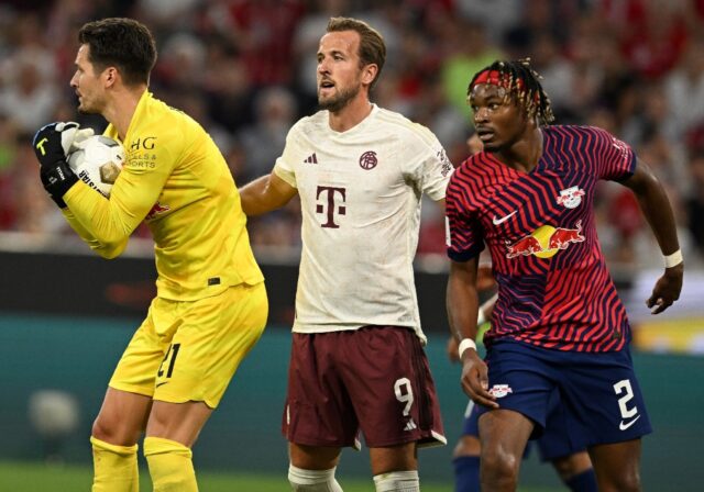 No way through: Leipzig goalkeeper Janis Blaswich gets the better of Harry Kane