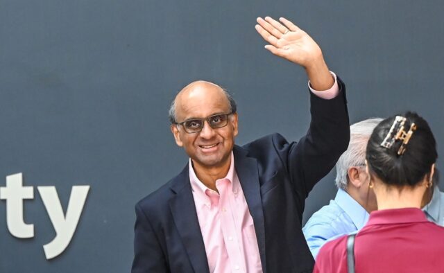 Presidential candidate Tharman Shanmugaratnam waves as he arrives at the nomination centre