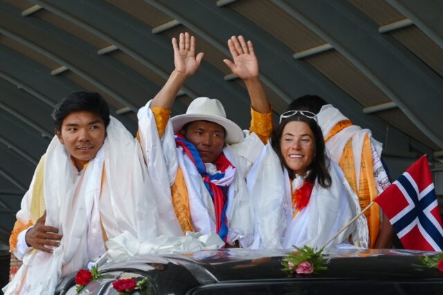 Record-breaking mountaineering duo Kristin Harila and Tenjin "Lama" Sherpa were greeted wi