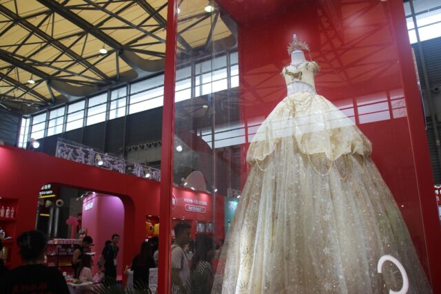 A shimmering, 1.5-metre-long golden ballgown stood pride of place at Pet Fair Asia in Shan