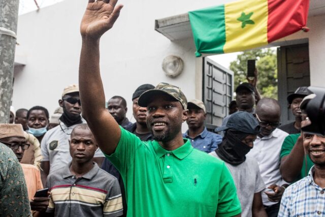 Sonko waving to followers in the southern town of Ziguinchor, a stronghold of support, in