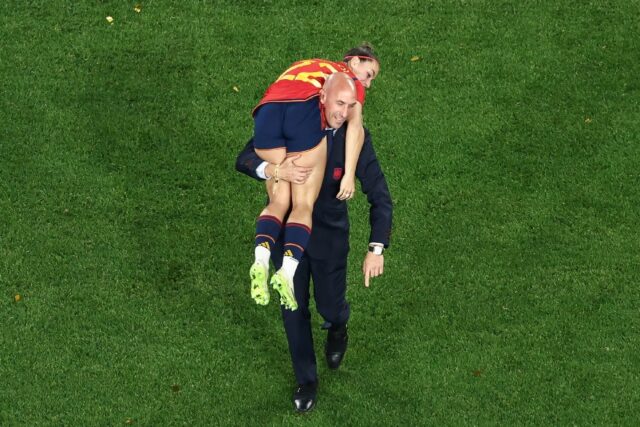 Spanish football federation chief Luis Rubiales carries player Athenea del Castillo after