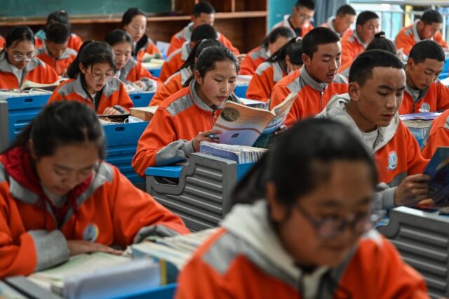 Students are seen in a classroom at the Lhasa Nagqu Second Senior High School in the Tibet