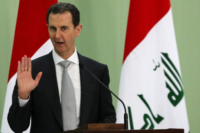 Syria's President Bashar al-Assad speaks during a press conference with Iraq's prime minis