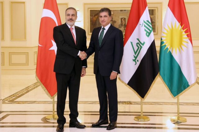 Turkey's Foreign Minister Hakan Fidan (L) held talks in the Iraqi northern city of Arbil w