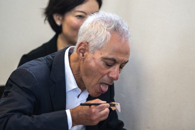 US Ambassador to Japan Rahm Emanuel eats seafood during a visit to the Fukushima area afte
