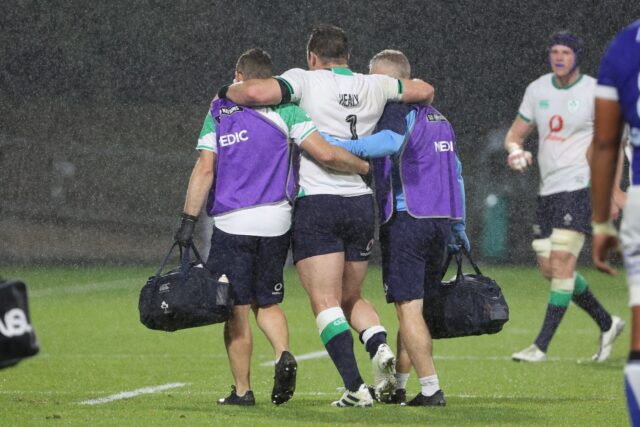 Worrying moment: Ireland prop Cian Healy leaves the pitch with a calf injury
