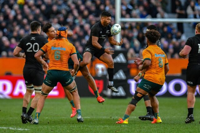 New Zealand's Richie Mo'unga (C) catches the ball against Australia. The playmaker says th