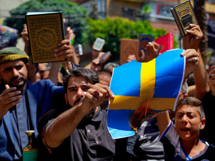 Hezbollah supporters chant slogans as they burn representations of the Swedish flag during a rally denouncing the desecration of the Quran after Friday prayers in the southern Beirut suburb of Dahiyeh, Lebanon, Friday, July 21, 2023. Muslim-majority nations expressed outrage Friday at the desecration of the Islamic holy book in …
