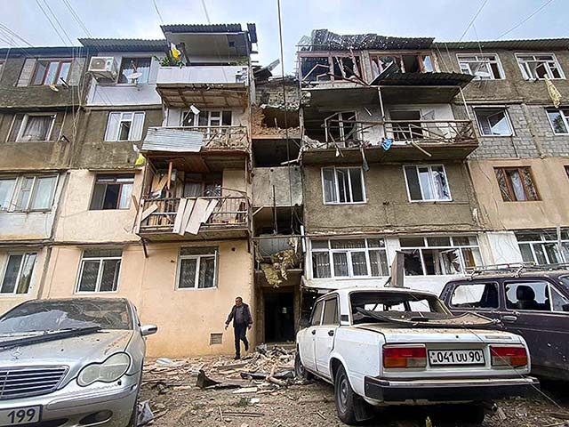 A damaged residential apartment building following shelling is seen in Stepanakert, Nagorn