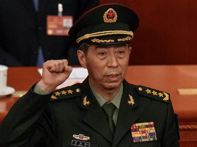 Newly elected Chinese Defense Minister Gen. Li Shangfu takes his oath during a session of