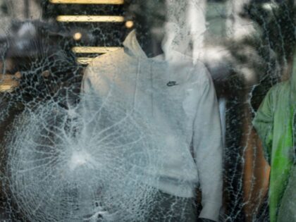 The glass window display of a Nike Inc. store stands shattered following looting on Michigan Avenue in Chicago, Illinois, U.S., on Monday, Aug. 10, 2020. Chicago police arrested more than 100 people for looting, disorderly conduct and battery against officers, among other charges, as crowds of people descended upon the …