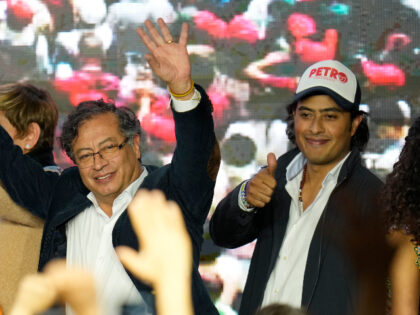 FILE - Presidential candidate Gustavo Petro, center, waves to supporters alongside his fam