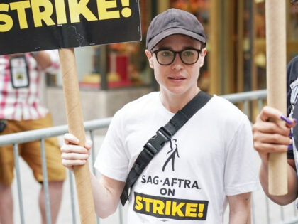 Elliot Page joins SAG-AFTRA members as they maintain picket lines in front of NBCUniversal on August 15, 2023 in New York City. Members of SAG-AFTRA and WGA (Writers Guild of America) have both walked out in their first joint strike against the studios since 1960. The strike has shut down …