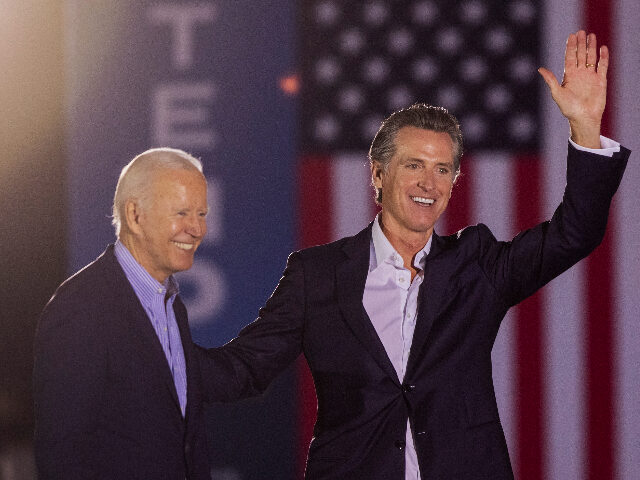 LONG BEACH, CA - SEPTEMBER 13: U.S. President Joe Biden and California Gov. Gavin Newsom wave to the crowd as they campaign to keep the governor in office at Long Beach City College on the eve of the last day of the special election to recall the governor on September …
