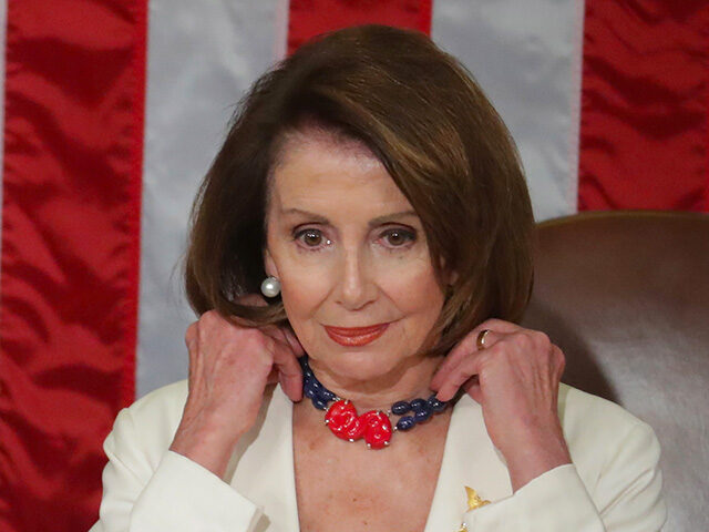 Nancy Pelosi (D-CA) look on ahead of the State of the Union address in the chamber of the