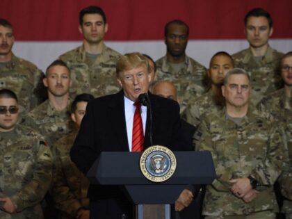 US President Donald Trump speaks to the troops during a surprise Thanksgiving day visit at