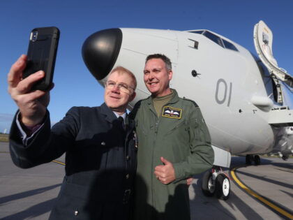 Squadron Leader Stuart 'Roxy' Roxburgh (left), who flew the RAF's last-ever Nimrod plane from the base, takes a selfie with Squadron Leader Mark Faulds who flew in the UK's first submarine-hunting P-8A Poseidon maritime patrol aircraft to Kinloss Barracks in Morayshire from NAS Jacksonville. (Photo by Andrew Milligan/PA Images via …