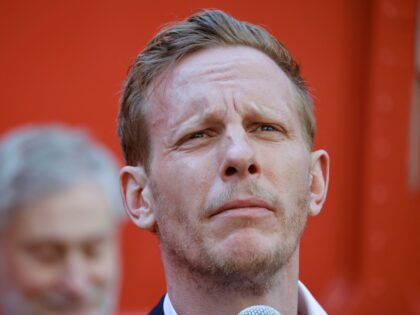 The Reclaim Party's Laurence Fox gestures during the unveiling of his battle bus for the L
