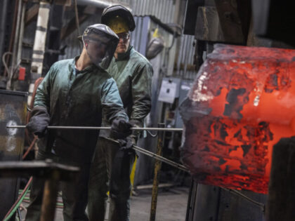 UNITED STATES - JUNE 2: Steelworkers attend to rolled steel at Lehigh Heavy Forge as Secre
