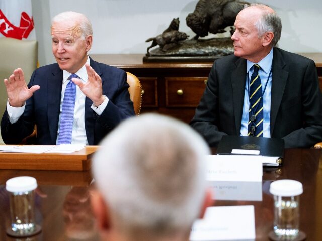 US President Joe Biden speaks alongside Steve Ricchetti (R), Counselor to the President, during a meeting with union and business leaders about the Bipartisan Infrastructure Framework in the Roosevelt Room of the White House in Washington, DC, July 22, 2021. (Photo by SAUL LOEB / AFP) (Photo by SAUL LOEB/AFP …