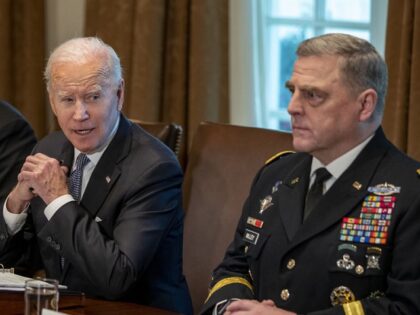 U.S. President Joe Biden, center, speaks beside Lloyd Austin, U.S. secretary of defense, l